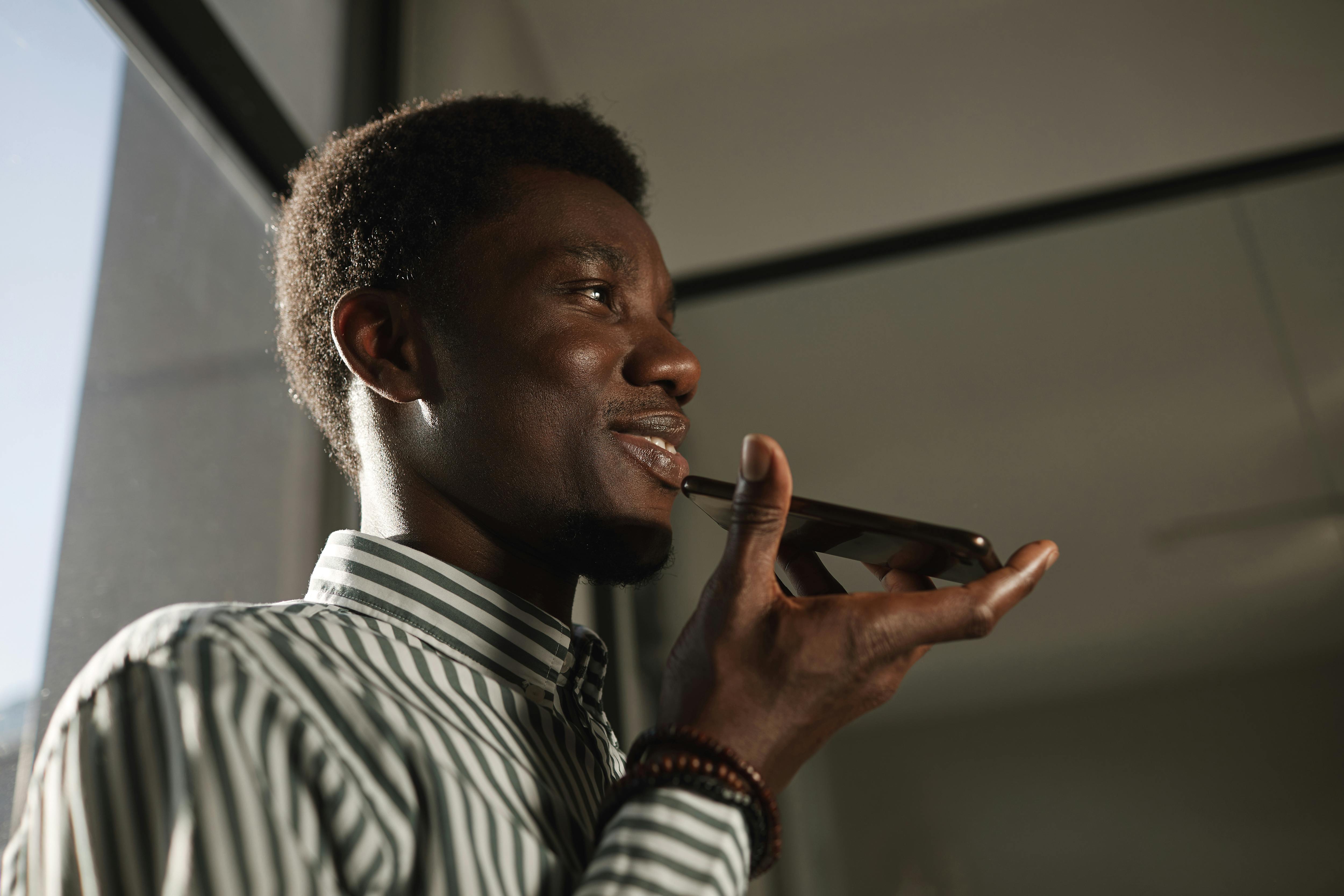 Person speaking expenses into phone